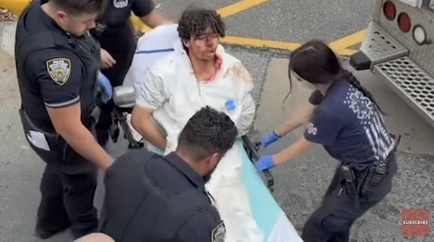 Staten Island teenager Damien Hurstel being loaded onto a stretcher covered in blood